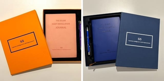 The 66-Day Habit Installation Journal in pink and navy blue, with branded pen and presentation box